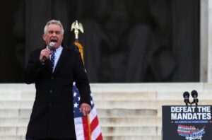 Robert F. Kennedy Jr. speaks during a rally following a march in opposition to coronavirus disease (COVID-19) mandates on the National Mall, in Washington, DC, US, January 23, 2022. (photo credit: REUTERS/TOM BRENNER)