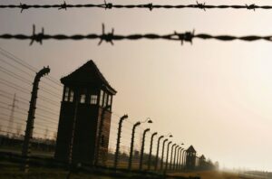 Watchtowers surrounded by multiple high-voltage fences at Auschwitz II-Birkenau in Poland. (Scott Barbour/Getty Images)