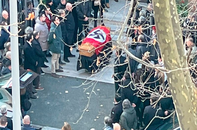 The flag was draped over the coffin bearing the body of Alessia Augello, a former member of far-right group Forza Nuova. Pic: Open Via AP