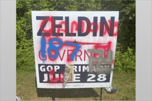 The defaced sign was in the town of Huntington in Long Island’s Suffolk County.