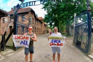 Polish authorities arrested Jon Minadeo Jr. (right) after he published a photo taken at Auschwitz. The photo sparked outrage on social media.