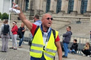 Convicted German Holocaust denier Reza Begi inciting demonstrators outside the German parliament in Berlin in May 2020. Photo: Twitter
