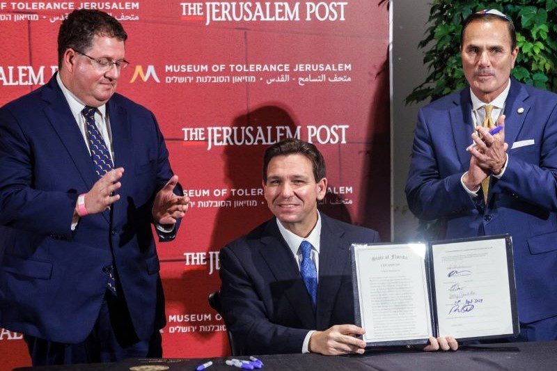 Florida Gov. Ron DeSantis signs legislation to combat antisemitism at the Jerusalem Post Conference in Jerusalem on Thursday.Kobi Wolf / Bloomberg via Getty Images